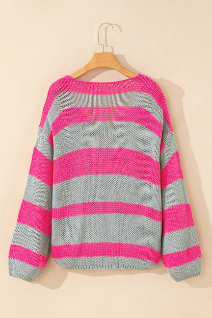Rosa gestreifter colorblock-strickpullover mit v-ausschnitt und lockerer passform