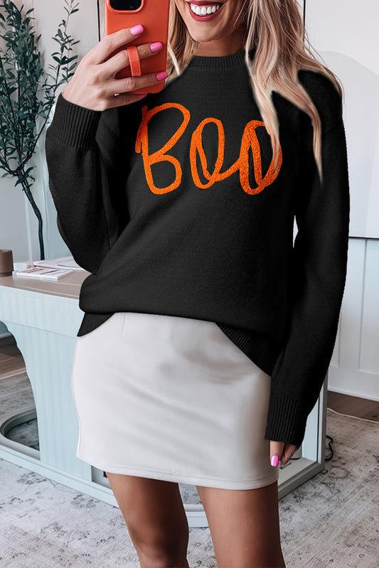 Schwarzer boo strickpullover mit geripptem rand und schultern