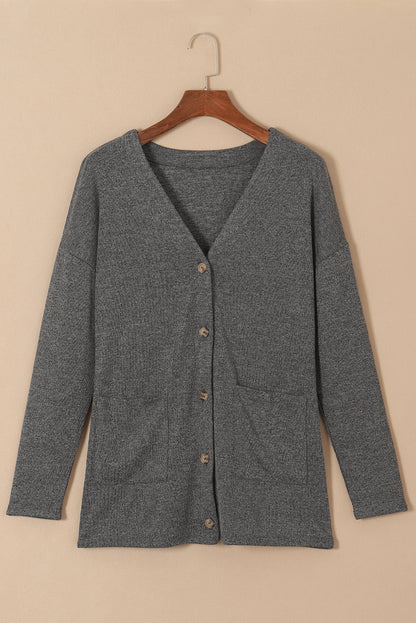 Strickjacke mit taschen und knopfleiste in grauem heidekraut