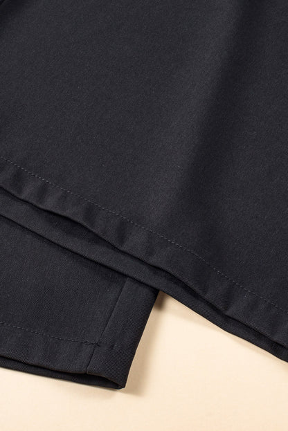 Schwarze plissierte elegante hose mit weitem bein