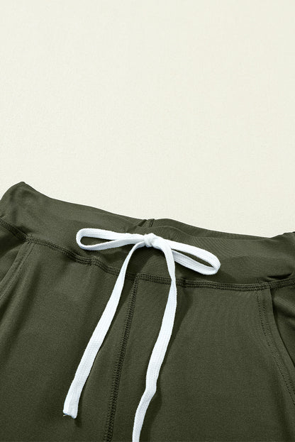 Moosgrüne jogginghose mit kordelzug an der taille