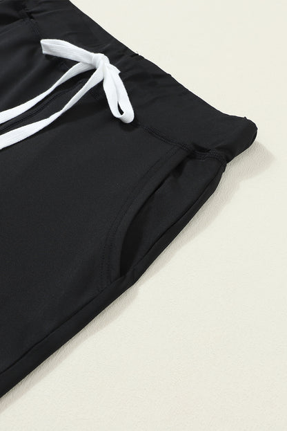 Schwarze jogginghose mit kordelzug an der taille