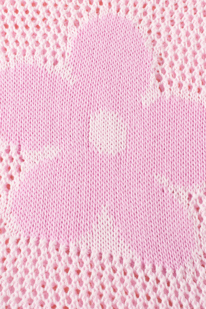 Rosafarbener pullover mit großer blume und hohlen schultern aus strick