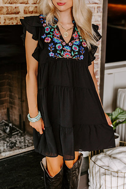 Schwarzes, mit blumen besticktes, gerafftes minikleid