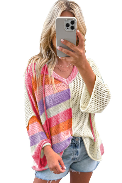 Rosa übergroßer colorblock-pullover mit v-ausschnitt und kapuze