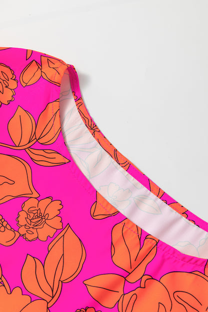 Rosa voluminöses kleid mit gerafften ärmeln und blumenmuster