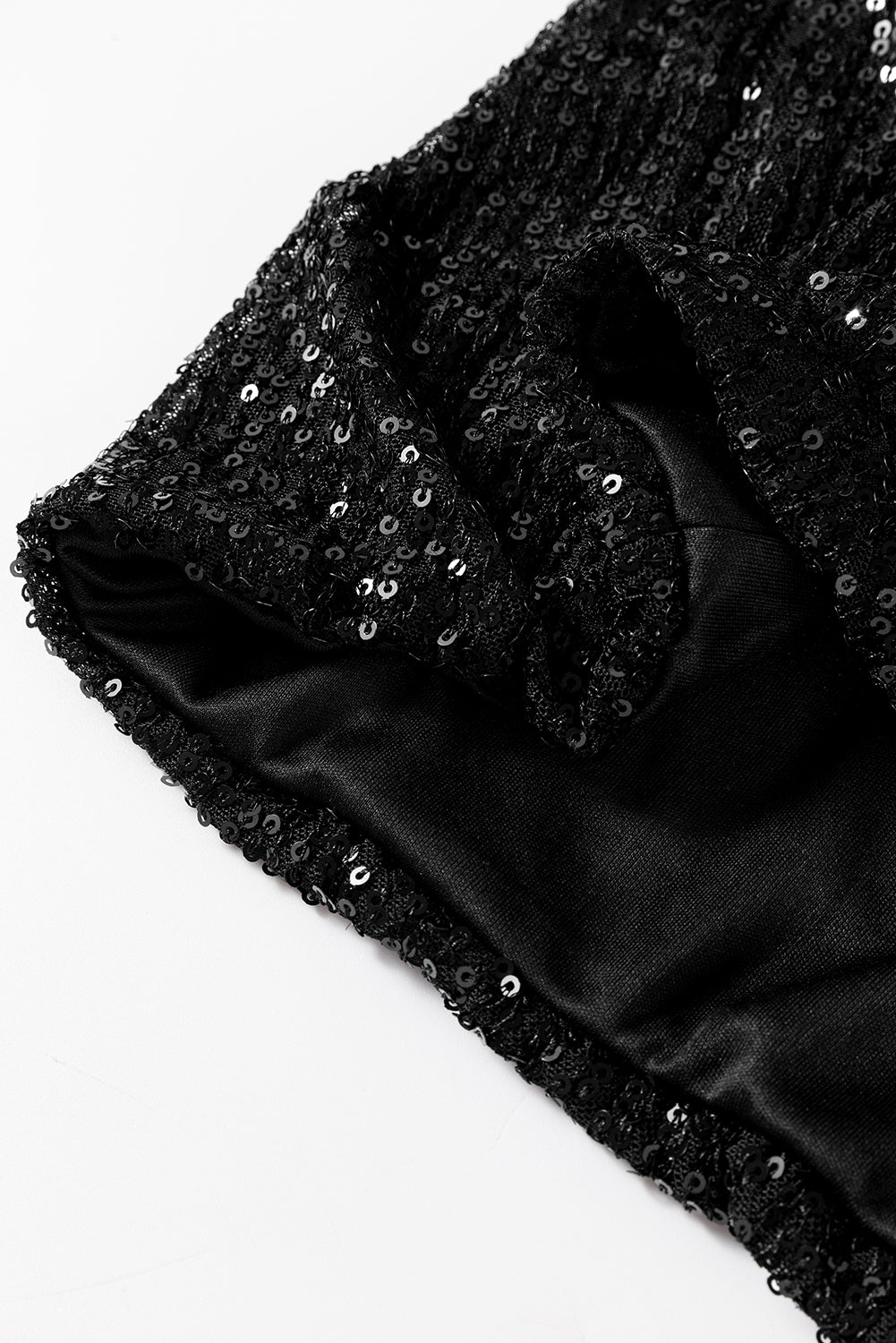 Schwarze paillettenjacke mit rundhalsausschnitt und langen ärmeln
