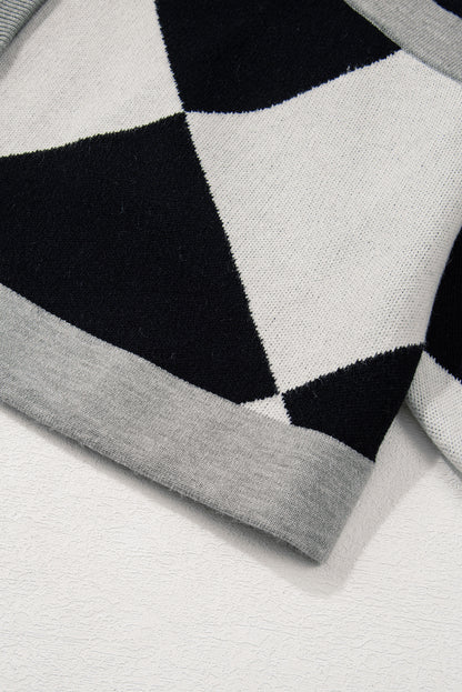 Schwarzer colorblock-cardigan mit geknöpften schultern und lockerer passform
