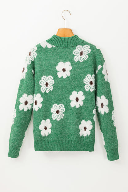 Grüner pullover mit floralem muster und halbem reißverschluss an der schulter