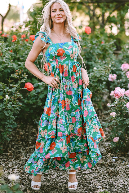 Grünes ärmelloses maxikleid mit blumendruck und rüschenbesatz