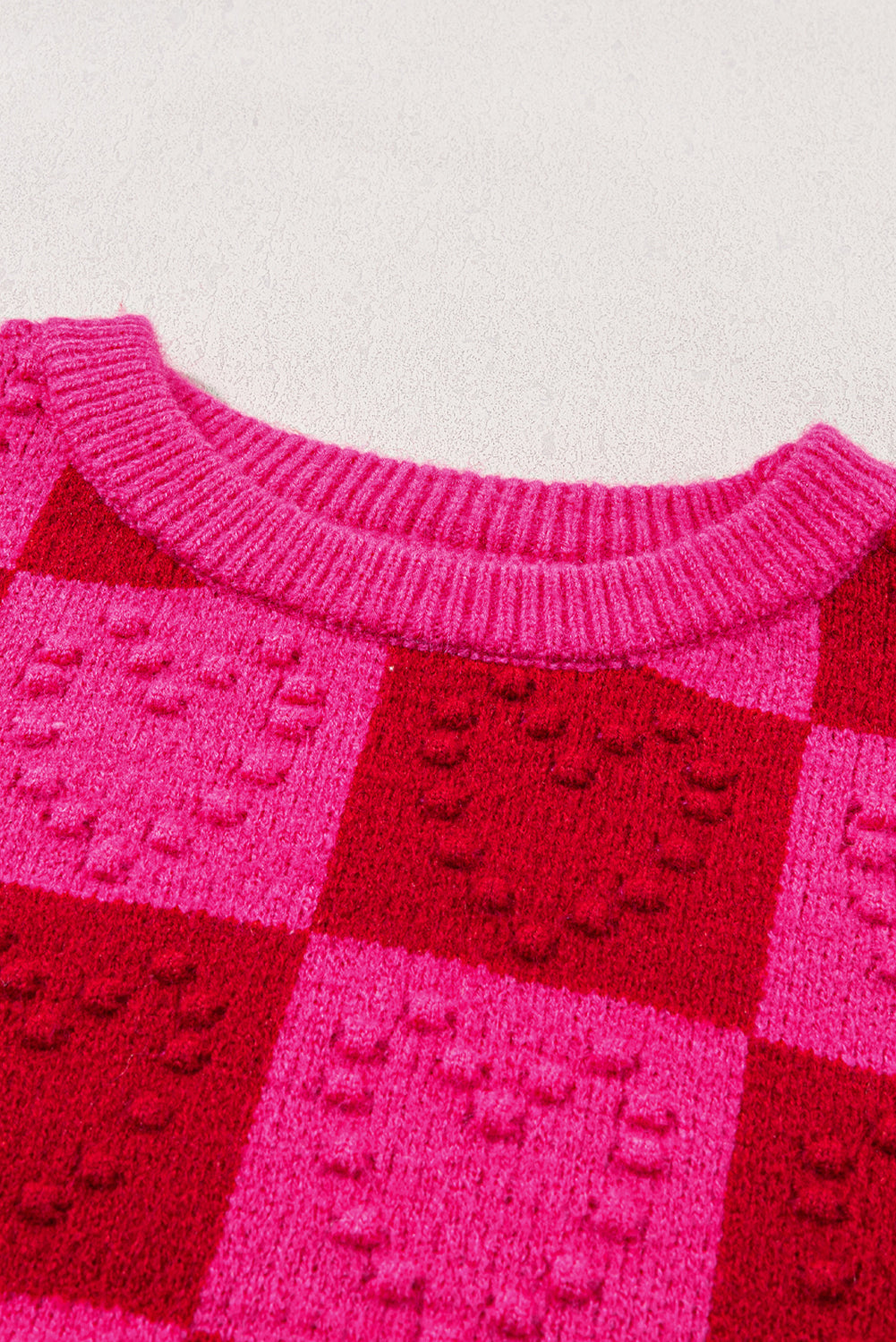 Mehrfarbig kariertes muster herz-detail strukturierter pullover