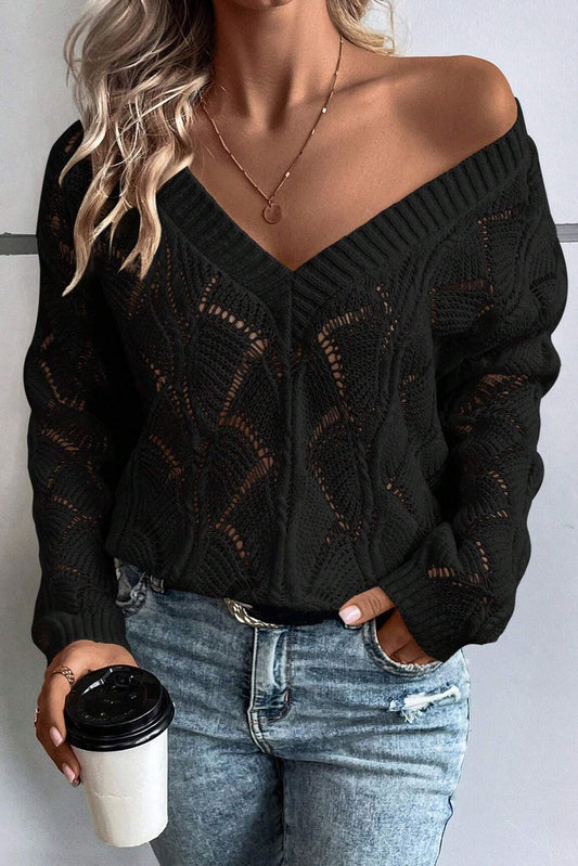 Schwarzer strickpullover mit v-ausschnitt und hohlen schultern