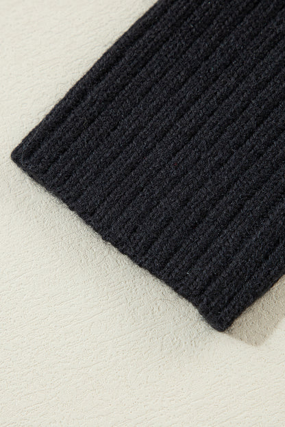 Schwarzer gestreifter, geknöpfter v-ausschnitt, lockere strickjacke mit hängenden schultern