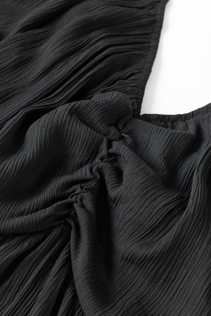 Schwarzes v-ausschnitt-schleifenknoten-ausschnitt-rüsche gestuftes maxikleid