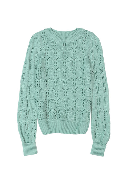 Grüner pointelle-pullover aus transparentem strick