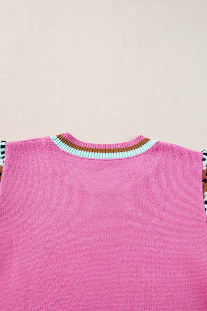 Leuchtend rosa, mit kontrast bedruckter pullover mit rundhalsausschnitt und langen ärmeln