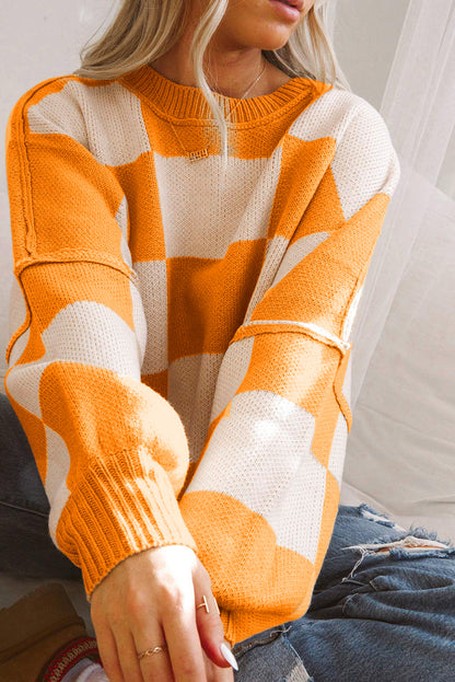 Orange karierter pullover mit läuferärmeln