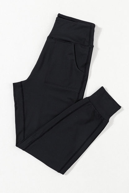 Schwarze jogginghose mit hoher taille und offener naht