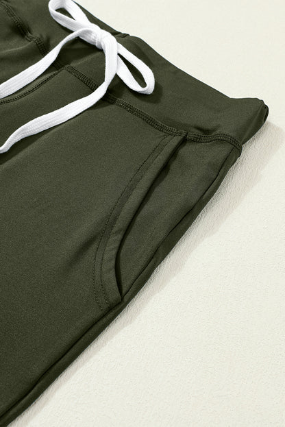 Moosgrüne jogginghose mit kordelzug an der taille
