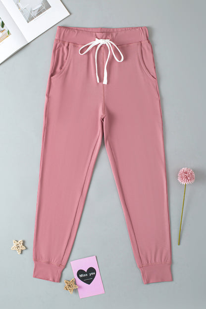 Fushia jogginghose mit kordelzug und taschenträgern