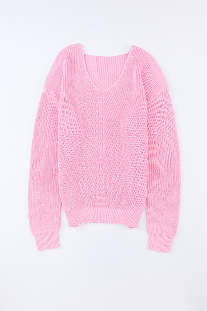 Rosa pullover mit v-ausschnitt aus rippenstrick