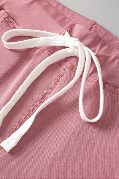 Fushia jogginghose mit kordelzug und taschenträgern