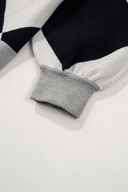 Schwarzer colorblock-cardigan mit geknöpften schultern und lockerer passform
