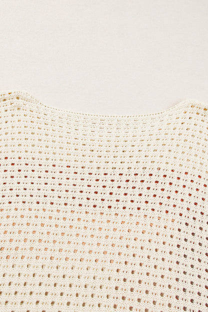 Aprikosenfarbener pointelle-strick-baggy-pullover mit farbblockmuster
