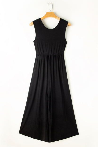 Schwarzer jumpsuit mit weitem bein und offenem rücken
