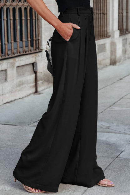 Schwarze plissierte elegante hose mit weitem bein