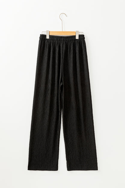 Schwarze strukturierte hose mit lockerem kordelzug