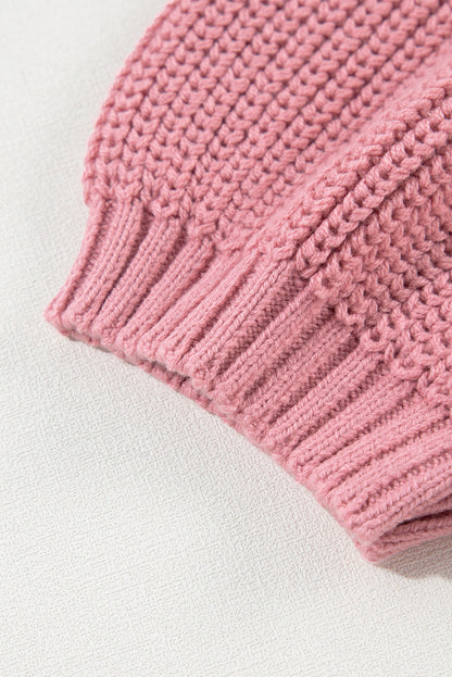 Rosa kabelstrickpullover mit gemischter struktur und kurzen ärmeln