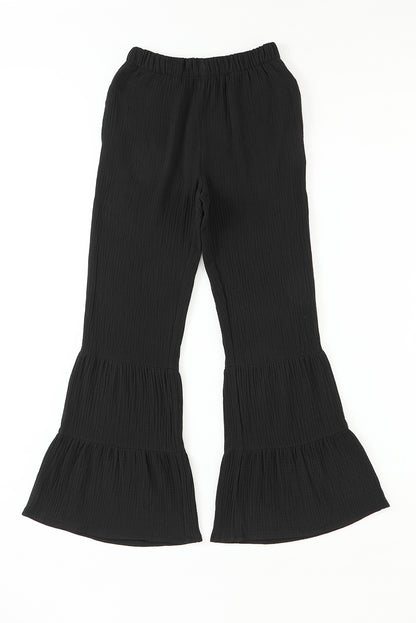 Schwarze strukturierte hose mit hoher taille und gerafftem glockenboden