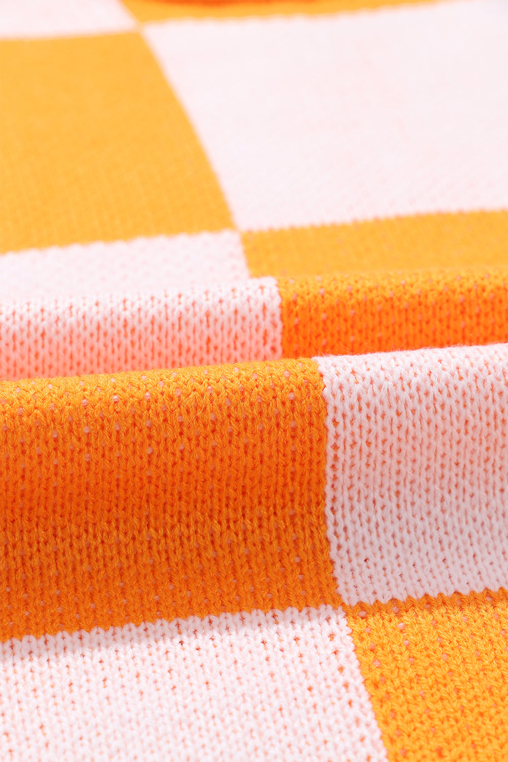 Orange karierter pullover mit läuferärmeln