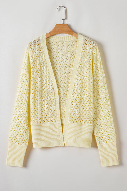 Gelbe creme pointelle-strickjacke mit offener vorderseite