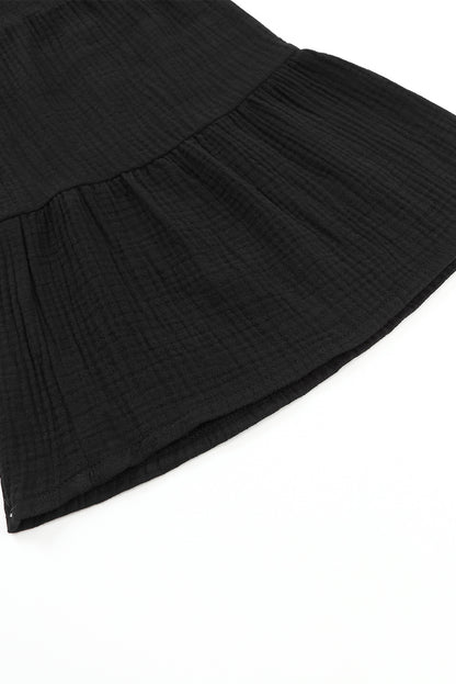 Schwarze strukturierte hose mit hoher taille und gerafftem glockenboden