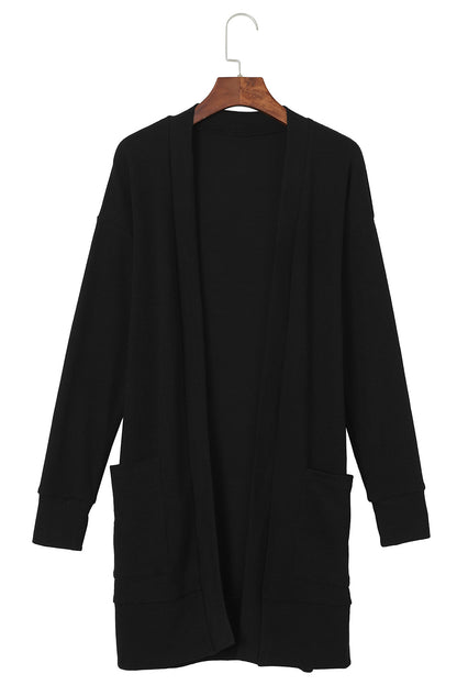 Schwarze thermo-waffelstrick-strickjacke mit taschen