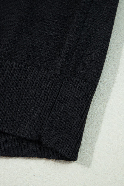 Schwarzer boo strickpullover mit geripptem rand und schultern