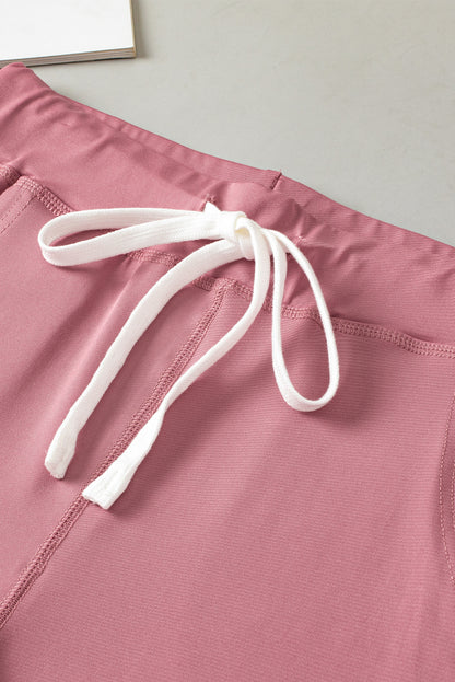Fushia jogginghose mit kordelzug und taschenträgern