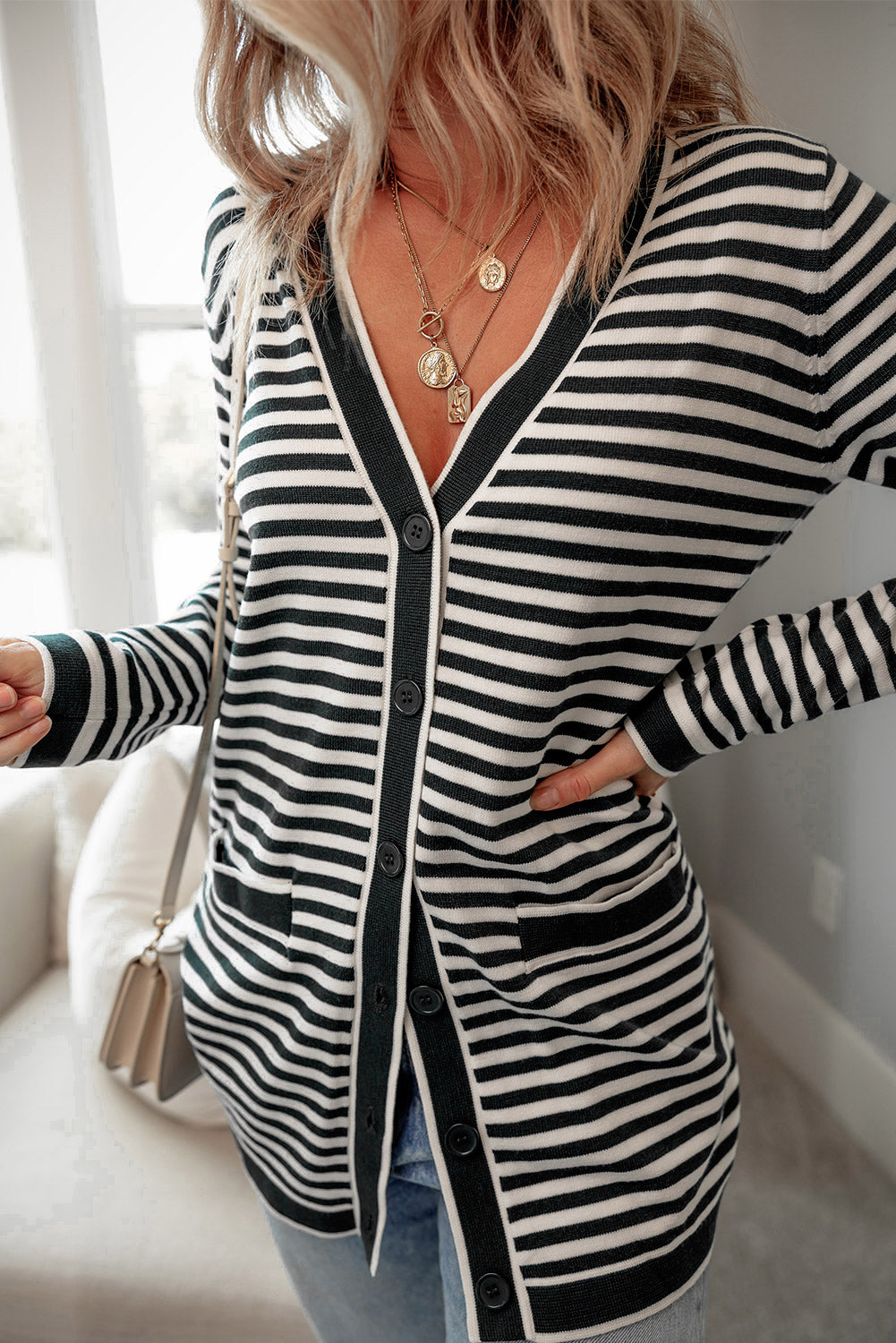Schwarz gestreifte langarm-tunika-strickjacke