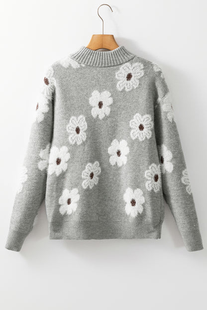 Grauer pullover mit floralem muster und halbem reißverschluss an der schulter