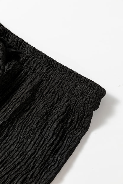 Schwarze strukturierte hose mit lockerem kordelzug