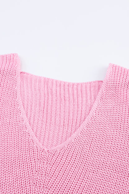 Rosa pullover mit v-ausschnitt aus rippenstrick