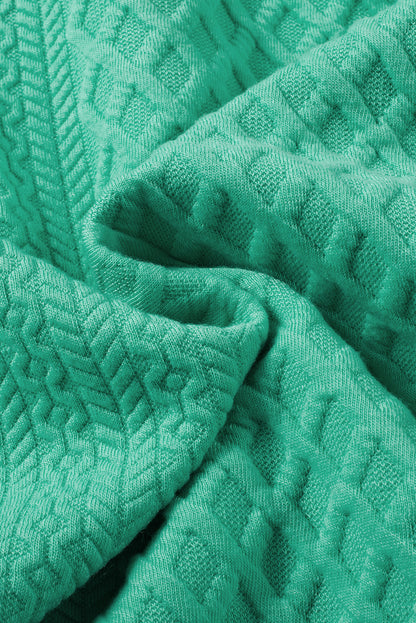 Seegrünes strukturiertes minikleid mit puffärmeln und gerafftem v-ausschnitt