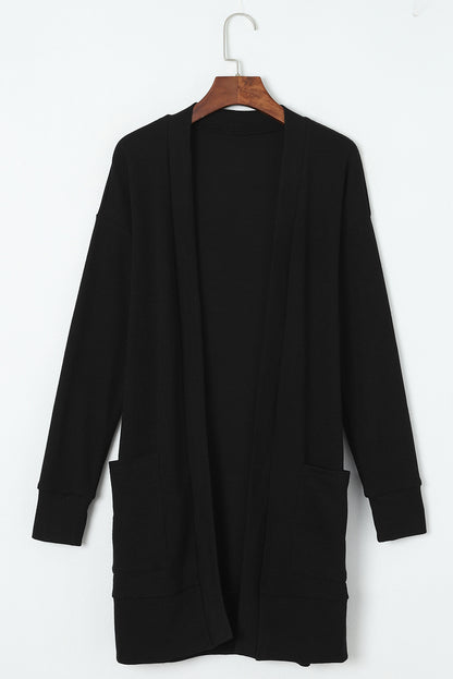 Schwarze thermo-waffelstrick-strickjacke mit taschen