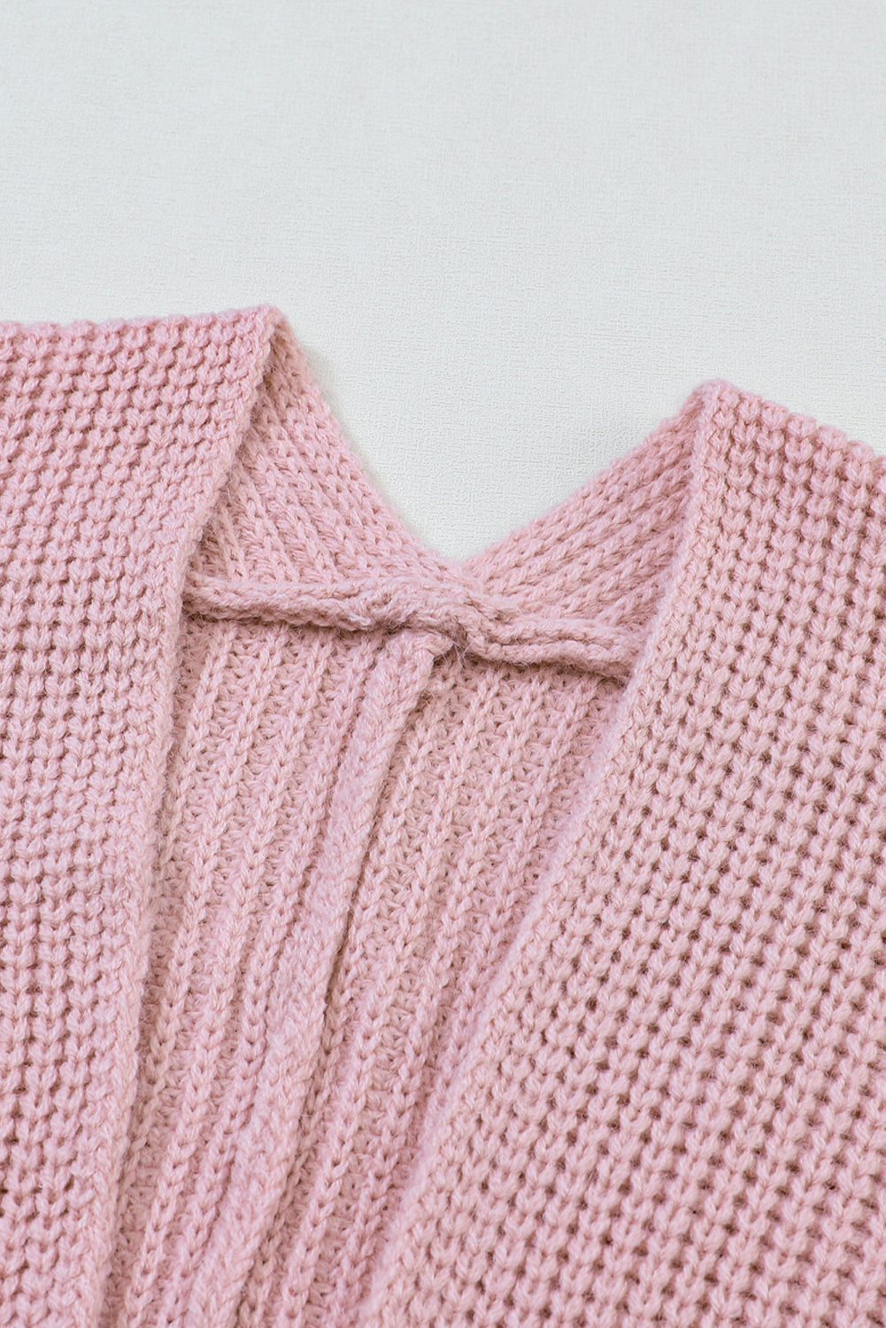 Rosa übergroßer pullover mit umgeschlagenen ärmeln cardigan