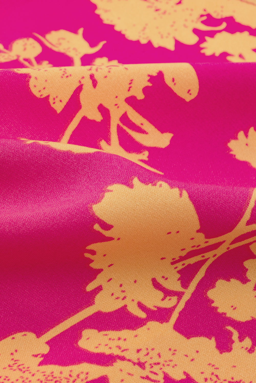 Rosafarbenes Kleid mit Fledermausärmeln und Blumendruck