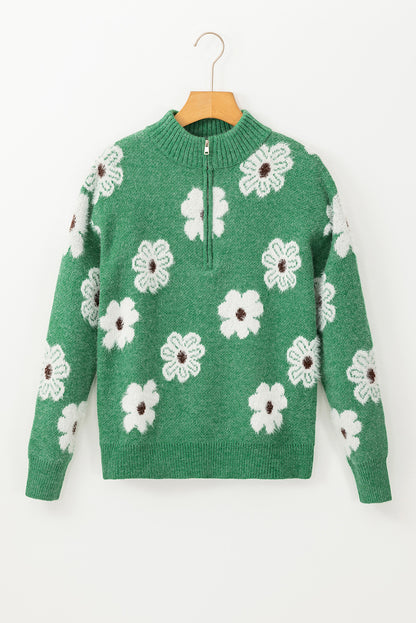 Grüner pullover mit floralem muster und halbem reißverschluss an der schulter