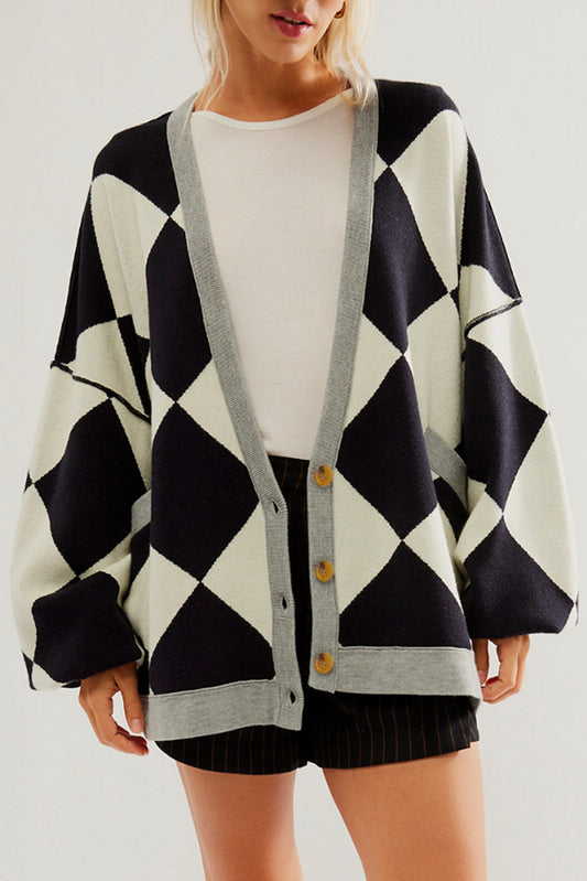 Schwarzer colorblock-cardigan mit geknöpften schultern und lockerer passform