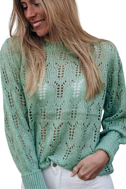 Grüner pointelle-pullover aus transparentem strick